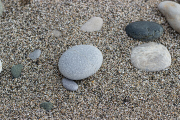 stones on the black sea coast on sand