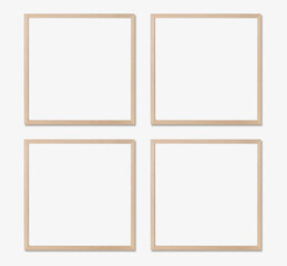 Picture frame mockup. Set of four square oak wooden frames on white wall. Templates for artwork,...