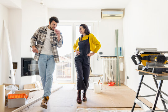 Boyfriend dancing with girlfriend inside new home