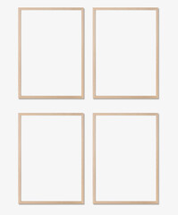 Picture frame mockup. Set of four vertical oak wooden frames on white wall. Templates for artwork, painting or poster