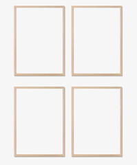 Picture frame mockup. Set of four vertical oak wooden frames on white wall. Templates for artwork,...