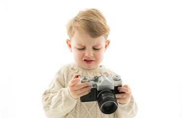 A little boy with a camera in his hands