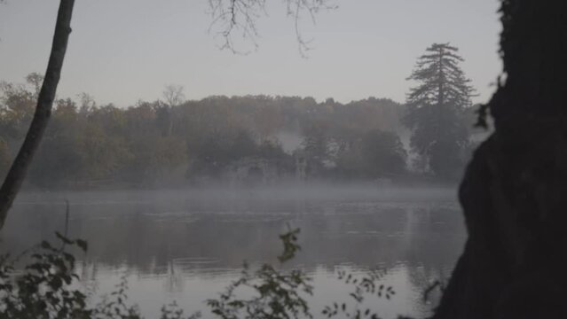 Misty morning at Majolan Park lake in Blanquefort France near Bordeaux, Locked shot