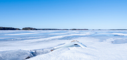 Fototapeta premium Abstract background of ice structure in a frozen lake landscape. Farnebofjarden national park in northof Sweden.