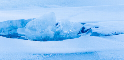 Fototapeta na wymiar Abstract background of ice structure in a frozen lake landscape. Farnebofjarden national park in northof Sweden.