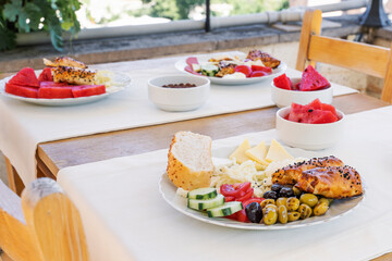 Assorted cheeses and olives, served with vegetables. Traditional Turkish food for breakfast in Goreme. Cappadocia