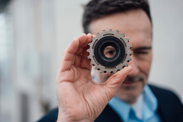 Businessman looking through an object