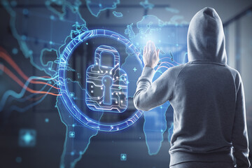 Hacker in hoodie using abstract digital padlock and map hologram on blurry office interior...