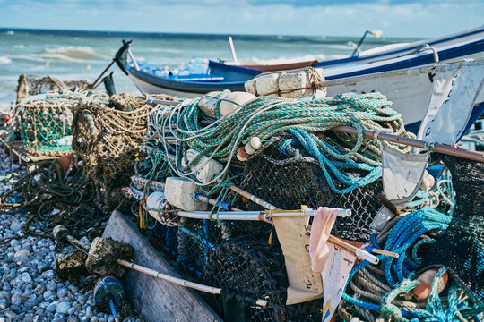 Fishing net and rowboat at beach