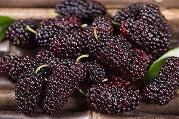 close up of ripe mulberriy fruit on table