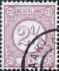 Netherlands - circa 1884 a postage stamp from the Netherlands , showing a number with ornament