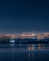 Fototapeta premium the city of Dnipro. Panoramic view of the night city from the river. Ukraine.