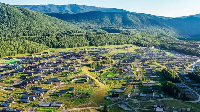 Aerial footage of Hemu village and forest with mountain natural scenery in Xinjiang, China. beautiful village in the valley.