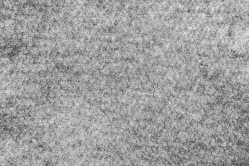 Fototapeta premium Dark gray knitted fabric openwork.