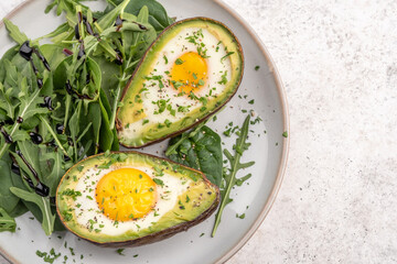 Healthy breakfast. Avocado stuffed with eggs. Low carb, keto diet food