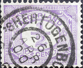 Netherlands - circa 1899 a postage stamp from the Netherlands , showing an ornament with number