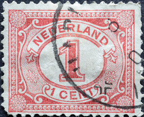 Netherlands - circa 1899 a postage stamp from the Netherlands , showing an ornament with number