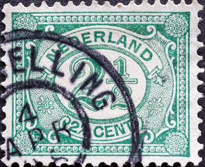 Netherlands - circa 1899 a postage stamp from the Netherlands , showing an ornament with number