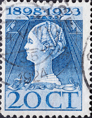 Netherlands - circa 1923 : a postage stamp from the Netherlands , showing a portrait of Queen...