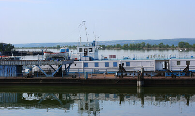 KAZAN, RUSSIA - July 7, 2021. Main passenger terminal in the river port of Kazan on the Volga river. Passenger ship moored in front of terminal. City of Kazan, Republic of Tatarstan, Russia.