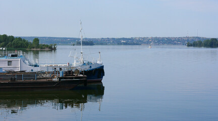 Fototapeta premium KAZAN, RUSSIA - July 7, 2021. Main passenger terminal in the river port of Kazan on the Volga river. Passenger ship moored in front of terminal. City of Kazan, Republic of Tatarstan, Russia.