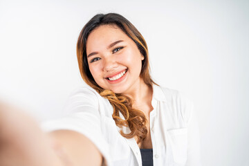 Asian woman holding a smart phone for selfie or video call