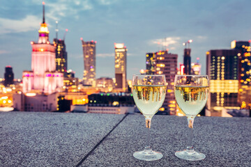 Wine with view on Warsaw, Poland at night
