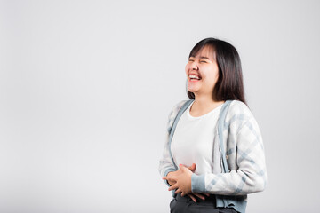 Woman winning and surprised excited screaming laughing studio shot isolated white background, Happy Asian portrait beautiful young female lifestyle cheerful smiling and laugh funny with copy space