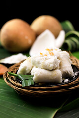 Kue Putu Medan or Kue Putu Bambu is a cake made from rice flour and formed using bamboo molds or mold from banana leaves, filled in palm sugar, served with grated coconut.