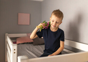 Cute little boy with a bouquet of flowers. Tulips. mothers Day. International Women's Day