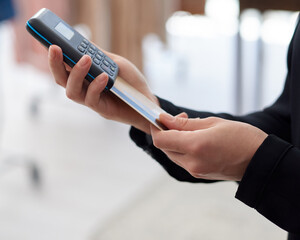 Settle your payment in an instant and with ease. Closeup shot of an unrecognisable woman using a credit card machine in a store.
