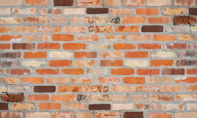 Orange red brown damaged rustic brick wall brickwork stonework masonry texture background pattern template architecture