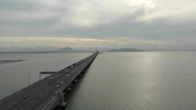 Aerial drone shot of the first Penang Bridge, view facing mainland. The bridge connects Prai on the mainland of Malaysia.