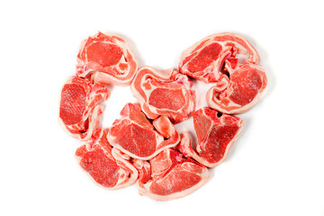 Nine fresh lamb loin chops in a shape of a heart. Love meat concept. Meat industry product. White background.