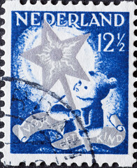 Netherlands - circa 1933: a postage stamp from the Netherlands , showing a Child with Twelfth Night...