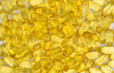 Cod liver oil omega-3 softgels. Background and texture from capsules