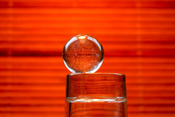 Glass ball in modern colors photographed in the studio to be used as a background