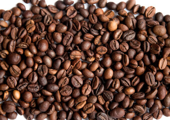 Roasted coffee beans on a white background. Coffee texture.