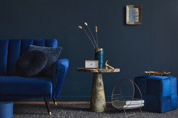 Modern living room interior composition with velvet blue sofa, design side table and elegant home...
