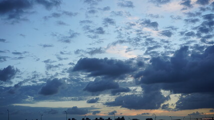 The beautiful sunset view with the colorful clouds and sky in the city