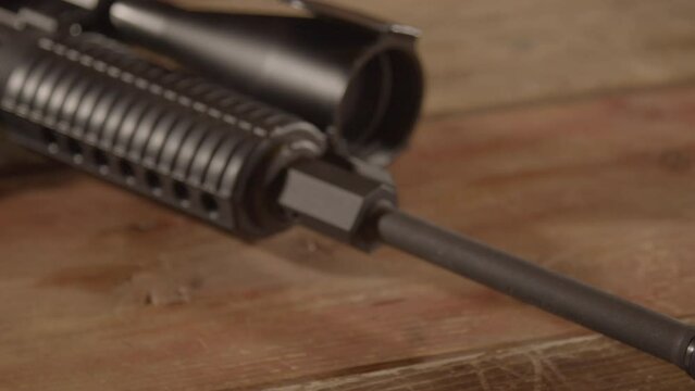 Close up of AR-15 barrel and muzzle. Slow dolly out