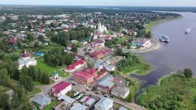 Aerial panoramic view of Russian town of Myshkin on banks of Volga River on summer day overlooking Assumption Cathedral and Nikolskaya church, Yaroslavl Oblast