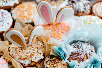 Easter orthodox sweet chocolate bread topped with white icing and colorful eggs on the linen napkin. Easter holidays background with copy space