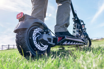 Electric scooter or e-scooter off road on grass in a field © Brian Jackson
