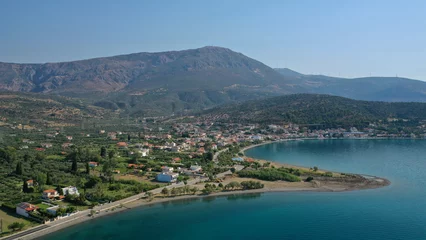 Foto op Canvas Aerial drone photo of picturesque seaside village and beach of Eratini in Fokida prefecture as seen in summer, Greece © aerial-drone