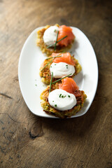 Homemade potato pancakes or lakes with salmon