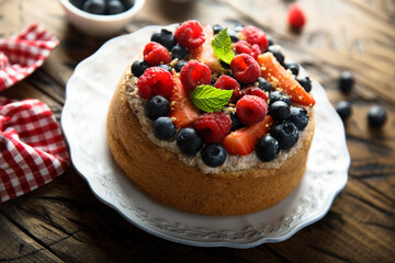 Homemade berry cake with cream filling