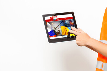 young journalist with tablet news, flag of russia and ukraine