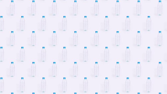 Plastic bottle crushing pattern time lapse on white background Plastic pollution art concept endless loop