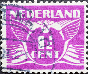 Netherlands - circa 1939: a postage stamp from the Netherlands, showing a stylized graphic. Flying...